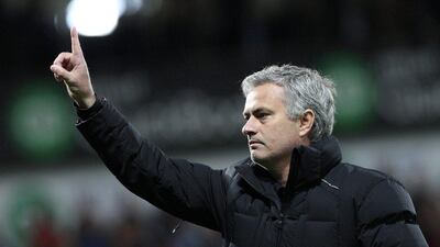 Chelsea manager Jose Mourinho acknowledges supporters after Monday night's loss to West Brom in the Premier League. Lindsey Parnaby / EPA / May 18, 2015