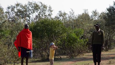 Jake Stuart learing to use a bow and arrow at Saruni Mara in Kenya. Photo by Stuart Butler