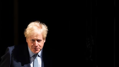 British Prime Minister Boris Johnson waits outside his London residence; UK police chiefs have put pressure on the UK leader to adopt a controversial new definition of Islamophobia EPA