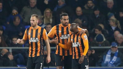 Sone Aluko is congratulated by teammates after scoring the equaliser in his side's 1-1 draw on Wednesday with Everton in the Premier League. Alex Livesey / Getty Images
