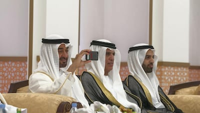 HH Sheikh Mohammed bin Zayed takes a photo on his phone. Mohamed Al Hammadi / Crown Prince Court - Abu Dhabi