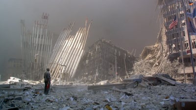 A man calling out asking if anyone alive trapped amid the rubble needs help after the collapse of the first tower on 9/11. AFP