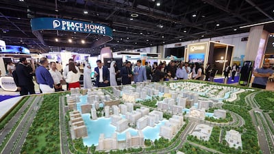 Visitors at the Azizi Developments activation. People attend the International Property Show (IPS) 2026. World Trade Centre, Dubai. Photo: Chris Whiteoak / The National