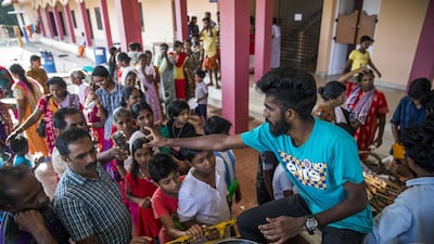 Volunteers serve tea and snacks to flood victims at a relief camp set up at Sree Narayana College Cherthala in Alappuzha, Kerala. Bloomberg