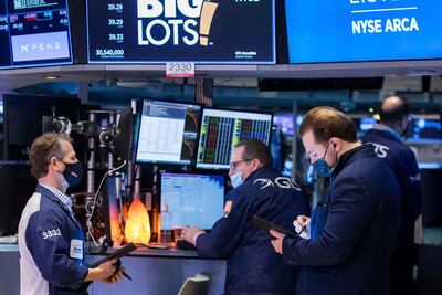 Traders work on the New York Stock Exchange floor on January 21, 2022. AP