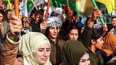 Syrian Kurdish women demonstrate in the northeastern Syrian city of Qamishli, as they mark the International Day for the Elimination of Violence against Women. AFP
