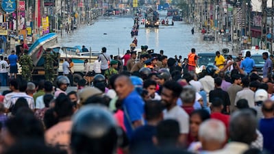 Army personnel ride a truck carrying boats to rescue stranded people in Colombo, Sri Lanka. AFP