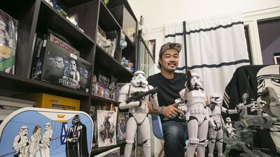 Yuji Ueda, the founder of Tokyo Toy Films, with his Star Wars stormtroopers collection in Abu Dhabi. Mona Al Marzooqi/ The National