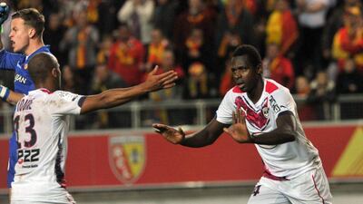 Cheick Diabate, right, celebrates with teammate Thomas Toure after scoring against Lens in Bordeaux's 2-1 Ligue 1 victory on Saturday. Francois Lo Presti / AFP / November 8, 2014