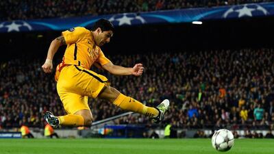Luis Suarez of Barcelona shoots during the Champions League match against Atletico Madrid on Tuesday night. David Ramos / Getty Images / April 5, 2016