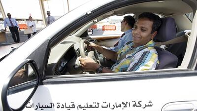 Kader Batcha, an expatriate from India, is instructed by Naeem Khan at the Emirates Driving Company in Mussaffah. Christopher Pike / The National