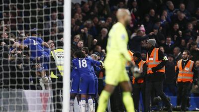 John Terry celebrates with his Chelsea teammates and fans at Stamford Bridge on Saturday after equalising against Everton. Stefan Wermuth / Reuters