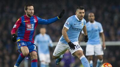 Manchester City's Sergio Aguero, right, fights for the ball against Crystal Palace's Yohan Cabaye during their English Premier League match at the Etihad Stadium, Manchester, England, Saturday Jan. 16, 2016. (AP Photo/Jon Super)