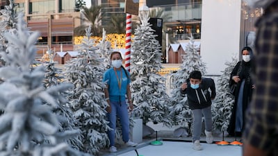 Curling game at the Winter Wonderland along the waterfront promenade of The Galleria Mall Al Maryah Island. Khushnum Bhandari / The National