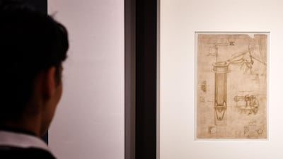 A visitor looks at a page of Leonardo da Vinci's 'Codex Atlanticus' during an exhibition in Rome, to mark 500 years since the artist died. AFP