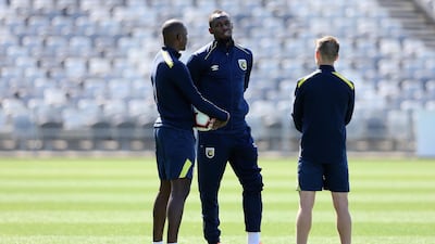 Usain Bolt talks with Mariners players during Usain Bolt's first training session. Getty Images