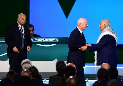 Fifa president Gianni Infantino, centre, interacts with the president of the Palestine Football Association Jibril Rajoub as the vice-president of Israel Football Association Basim Sheikh Suliman looks on. AFP