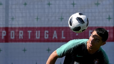 Portugal's forward Cristiano Ronaldo controls a ball during a training session at the team's base in Kratovo, outside Moscow. Francisco Leong / AFP