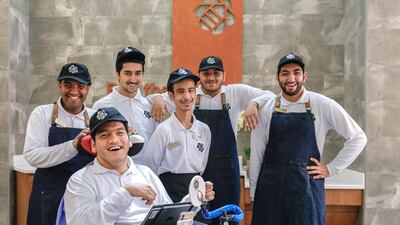 (L-R) Saeed Al Ameri, Khalid Waleed Mohammed, Mansoor Al Hammadi, Salim Al Tamami, Mohammed Al Haj and Hazza Al Muhairbi are the employees behind The Bee Cafe. Victor Besa / The National