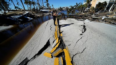The only bridge to the island is heavily damaged. AP