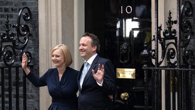 UK Prime Minister Liz Truss and husband Hugh O'Leary pose outside No. 10. Getty Images