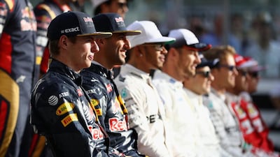 Max Verstappen, Daniel Ricciardo, Lewis Hamilton and otehr drivers pose for a F1 Drivers Class of 2016 group photo during the Abu Dhabi Formula One Grand Prix at Yas Marina Circuit on November 27, 2016 in Abu Dhabi. Clive Mason / Getty Images