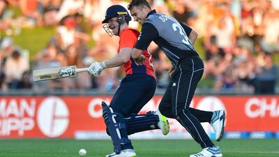 New Zealand's captain Tim Southee, right, collides with England counterpart Eoin Morgan. AFP