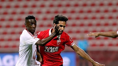 Habib Al Fardan, right, of Al Ahli said he was not surprised that Omar Abdulrahman renewed his contract with Al Ain, but he still expects his national-team colleague to eventually test himself outside the country. Satish Kumar / The National