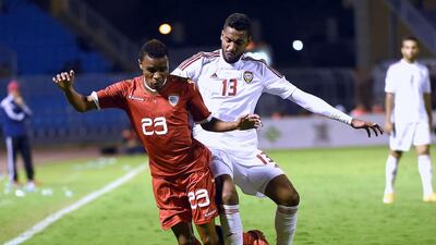 UAE footballer Khamis Esmail, right, fights for the ball with Oman's Juma Darwish during the third place play-off of the 22nd Gulf Cup football match at the Prince Faisal bin Fahd Stadium in Riyadh. AFP PHOTO/ FAYEZ NURELDINE