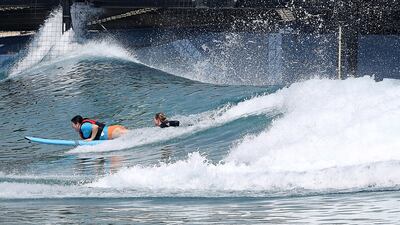 Writer Evelyn Lau learns to surf with guide Gabi Lailvaux. Pawan Singh / The National