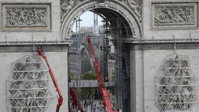 Workers are preparing the famed Paris monument for the project called 'L'Arc de Triomphe, Wrapped' by late artist Christo who wished this project to be continued after his death. AP