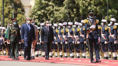 Sudan's Sovereign Council Chief General Abdel Fattah al-Burhan walks with Egyptian President Abdel Fatah al-Sisi, during a welcome ceremony in Khartoum, Sudan. Reuters