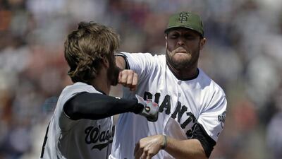 Washington Nationals' Bryce Harper, left, prepares to hit San Francisco Giants' Hunter Strickland after being hit with a pitch in the eighth inning of a game on Monday in San Francisco. Ben Margot / AP Photo