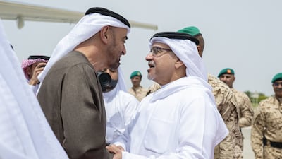 Sheikh Mohamed greets Crown Prince Salman, First Deputy Supreme Commander of Bahrain, on arriving in the country