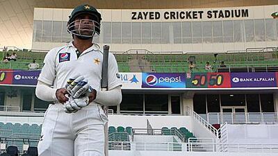 Taufeeq Umar walks out on to the pitch to resume his stand as Pakistan continue to accumulate runs in their first innings against Sri Lanka.