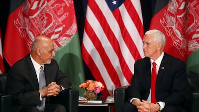 Ashraf Ghani and Mike Pence attend a meeting. Reuters
