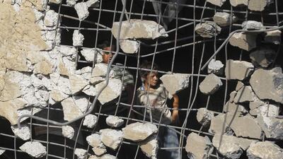Palestinian children inspect a destroyed mosque following an overnight Israeli military strike in Rafah the southern Gaza Strip. UN chief Ban Ki-moon and US Secretary of State John Kerry are in Cairo in a bid to broker a truce between Israel and Hamas after two weeks of fighting which has left over 570 Palestinians dead. Said Khatib / AFP