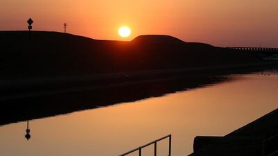The sun rises over the Delta-Mendota Canal in Los Banos, California. The US Bureau of Reclamation officials announced that they will not be providing Central Valley farmers with any water from the federally run system of reservoirs and canals fed by mountain runoff. Justin Sullivan / Getty Images / AFP