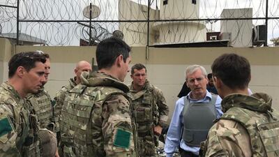Britain’s ambassador to Afghanistan, Laurie Bristow, meets UK troops involved in the evacuation of Kabul. Photo: Reuters