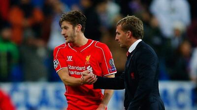 Adam Lallana of Liverpool shakes hands with manager Brendan Rodgers after their loss to Real Madrid in the Champions League on Tuesday night. Gonzalo Arroyo Moreno / Getty Images / November 4, 2014