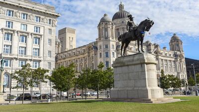 The Cunard Building and the Liver Building, behind a statue of Edward VII on his horse, on Liverpool waterfront