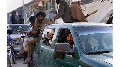 In this file photograph taken on April 6, 2009, Afghan Taliban fighters sit on their pickup vechile in the Sangin district of Helmand province. US President Barack Obama will order his promised US troop drawdown from Afghanistan in a primetime address June 22, 2011 which one official said would likely see 10,000 soldiers called home this year.