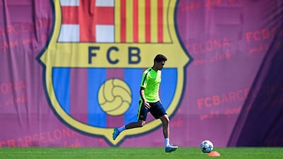 Marc Bartra of Barcelona dribbles the ball during the team training session on Tuesday for Saturday's Champions League final. David Ramos / Getty Images