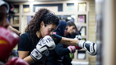 Women going through their exercise during a class in Mixed Martial Arts (MMA) in Giza, south-west of Cairo on the International Day for the Elimination of Violence Against Women. EPA