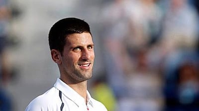 Novak Djokovic is all smiles after enjoying his time on the surface in Abu Dhabi, beating David Ferrer.