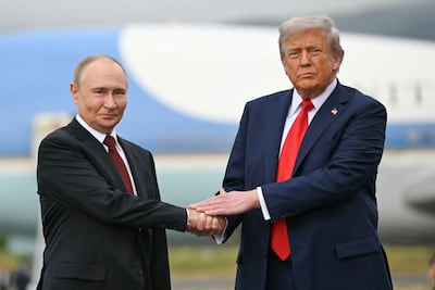 US President Donald Trump greets Russian President Vladimir Putin in Alaska. AFP