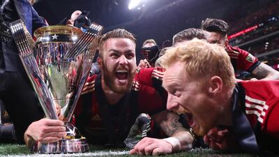 Atlanta United's players celebrate with the MLS Cup. Reuters