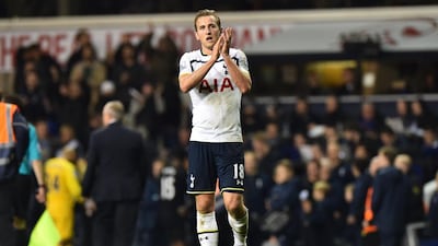 Tottenham Hotspur’s English striker Harry Kane applauds their supporters at the final whistle in the English Premier League football match between Tottenham Hotspur and Everton at White Hart Lane in north London on November 30, 2014. Tottenham won the game 2-1. AFP PHOTO / BEN STANSALL