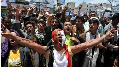 Anti-government protesters shout slogans during a demonstration demanding the ousting of Yemeni president Ali Abdullah Saleh in Sana'a yesterday.
