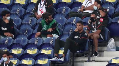 Portugal's Cristiano Ronaldo, foreground right, watches from the stands. AP Photo